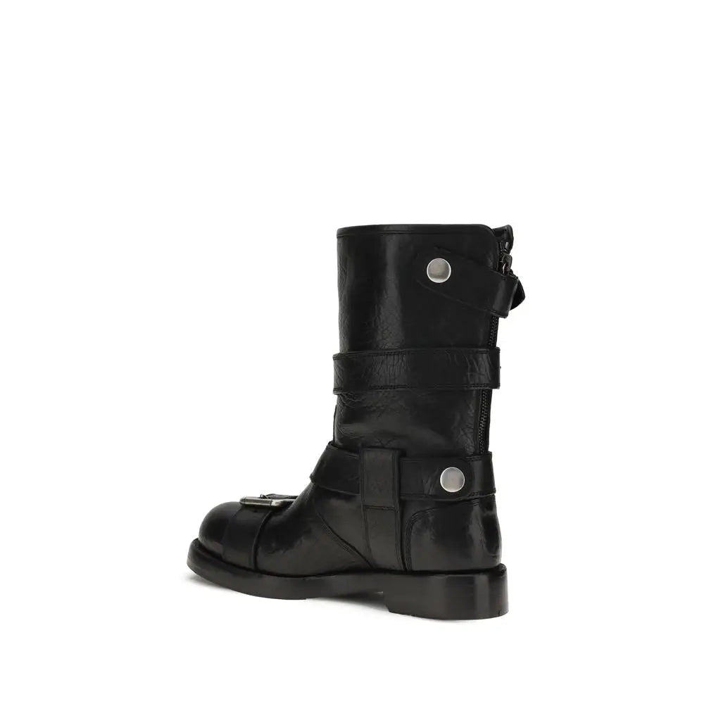 Dolce & Gabbana buckled leather boots in black with straps and silver hardware