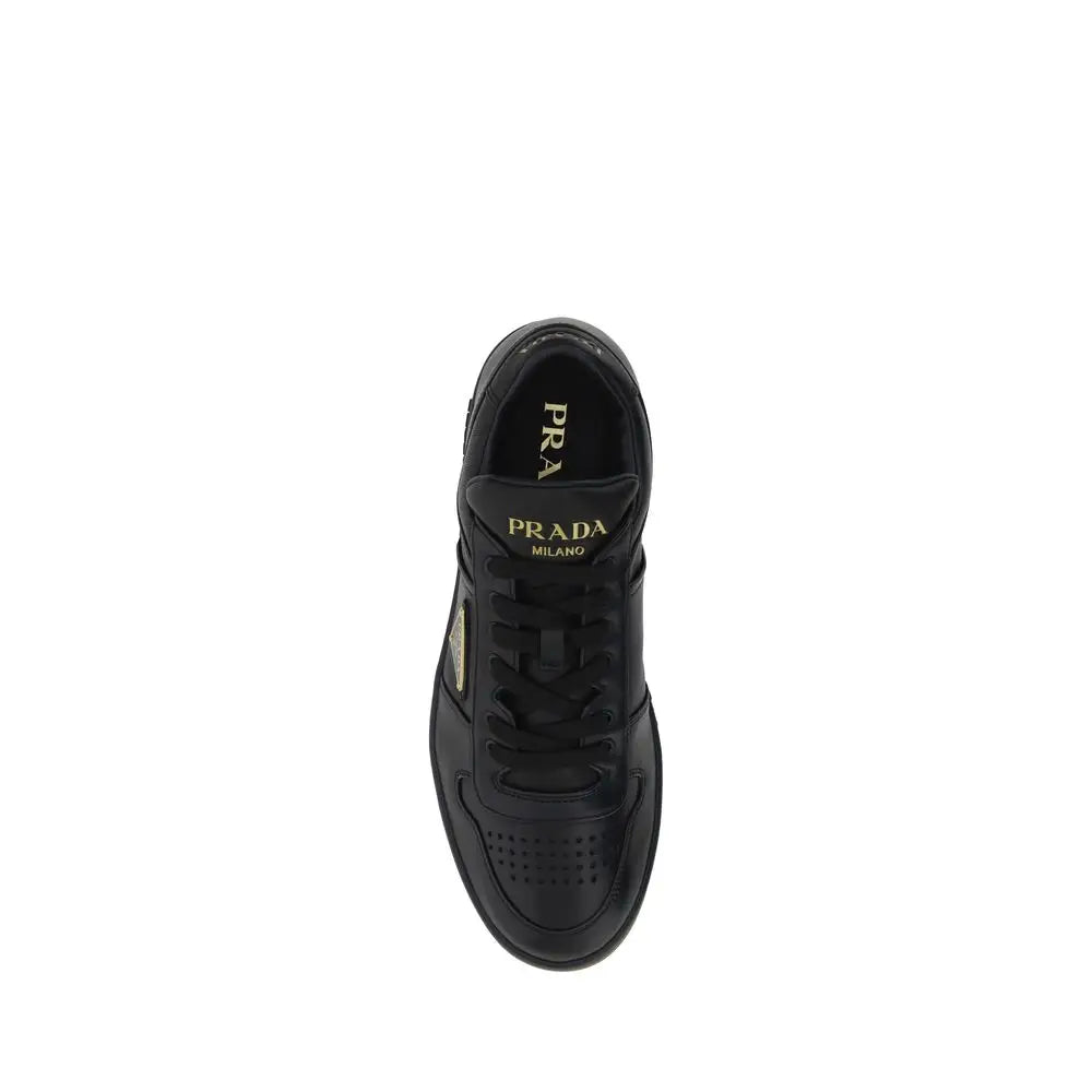 Prada black calf leather Bos Taurus low top sneaker with gold branding and perforations