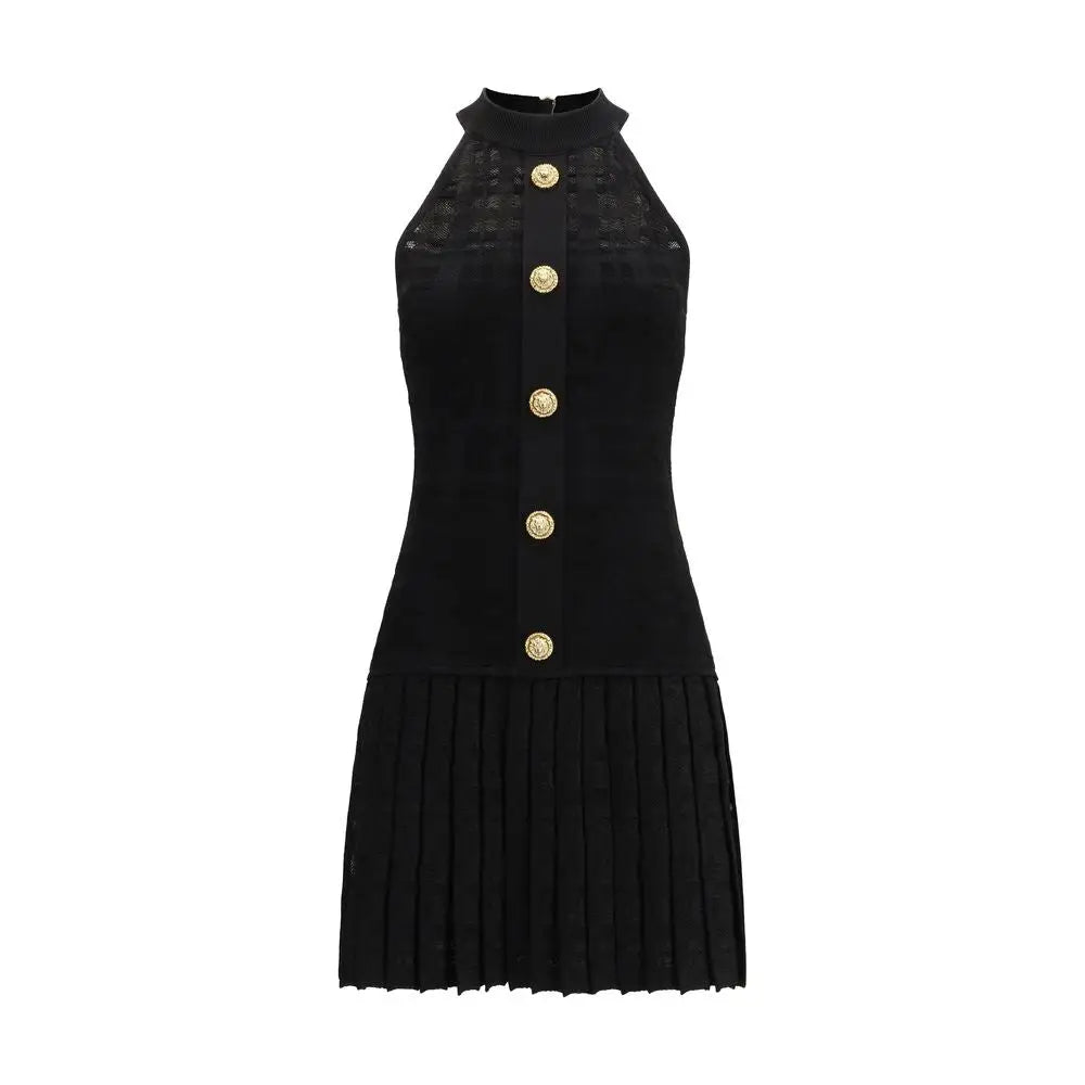 Balmain sort halter-hals kjole i sort viscose med guldknapper og plisséreret nederdel