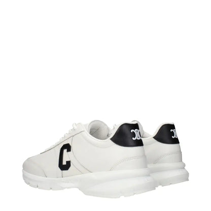 Celine white leather athletic sneakers with black logo accents and chunky sole