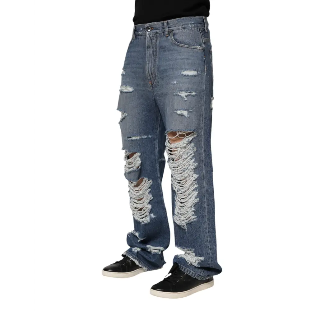 Distressed Dolce & Gabbana blue tattered cotton logo plaque denim jeans