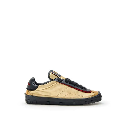 Dolce & Gabbana gold leather low top sneakers with black accents and red stitching