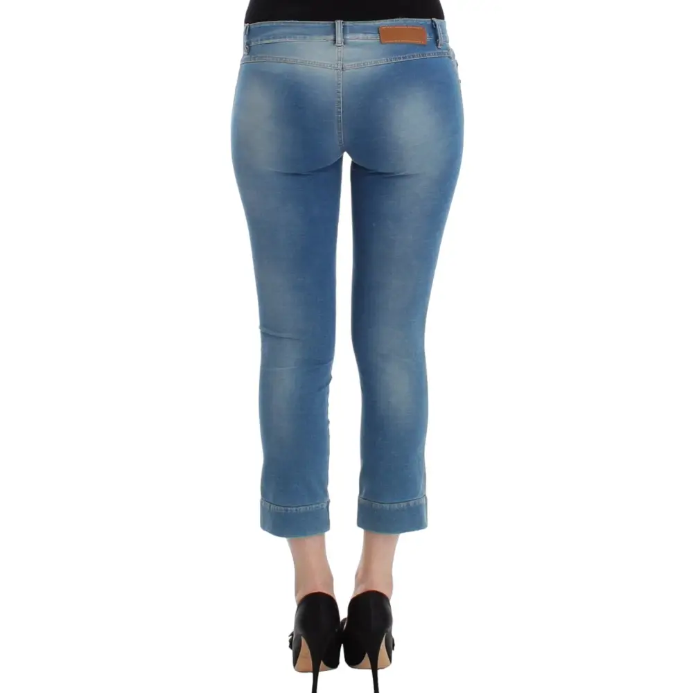 Ermanno Scervino beachwear capri pants i blå denim med falmet vask og rullede manchetter
