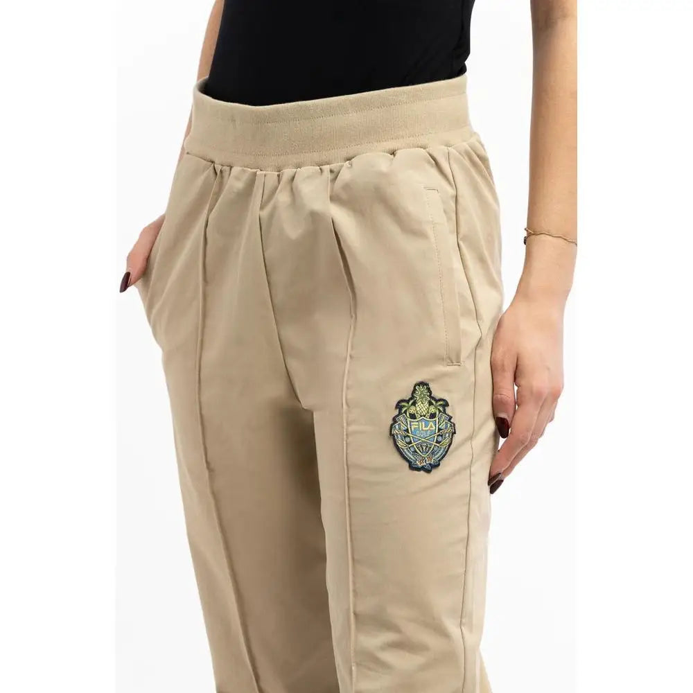 Fila grønne bomuldsjoggers med beige logo, elastik talje og side lommer