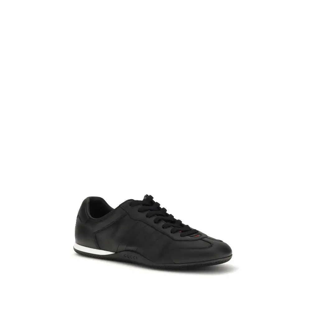 Gucci black calf leather Bos Taurus low top sneaker with white sole and red stitching