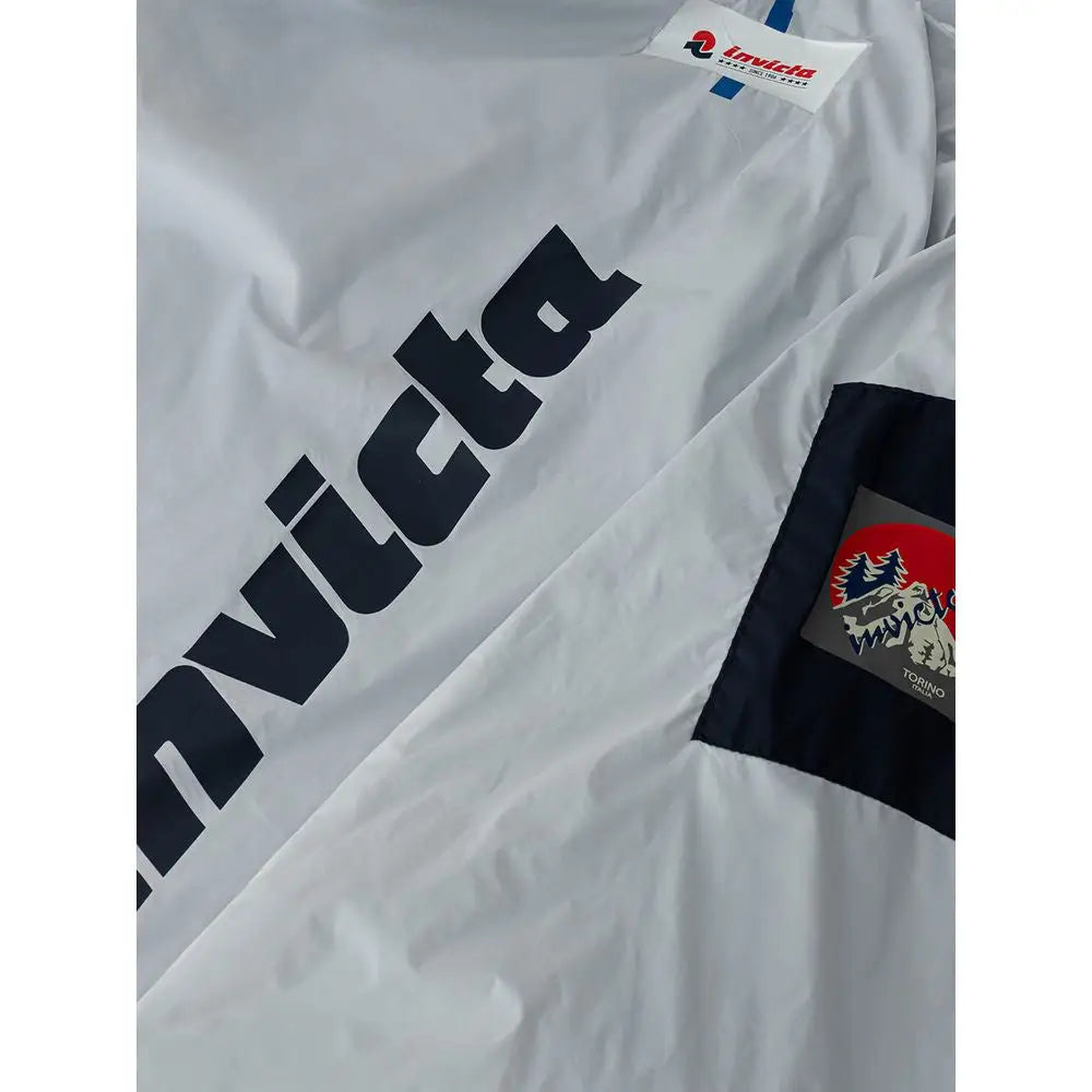 Invicta blue polyamide jacket with white anorak, black lettering and navy patch