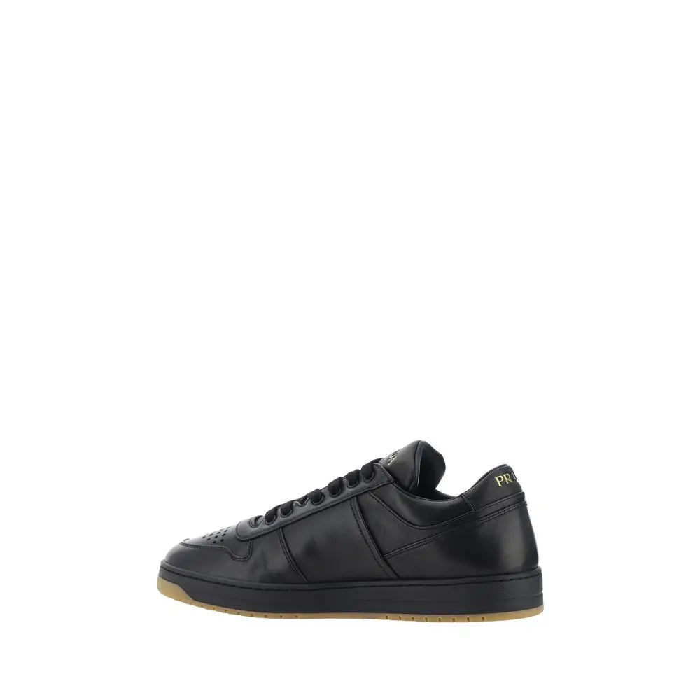Prada black calf leather Bos Taurus low-top sneaker with gold heel branding and tan sole