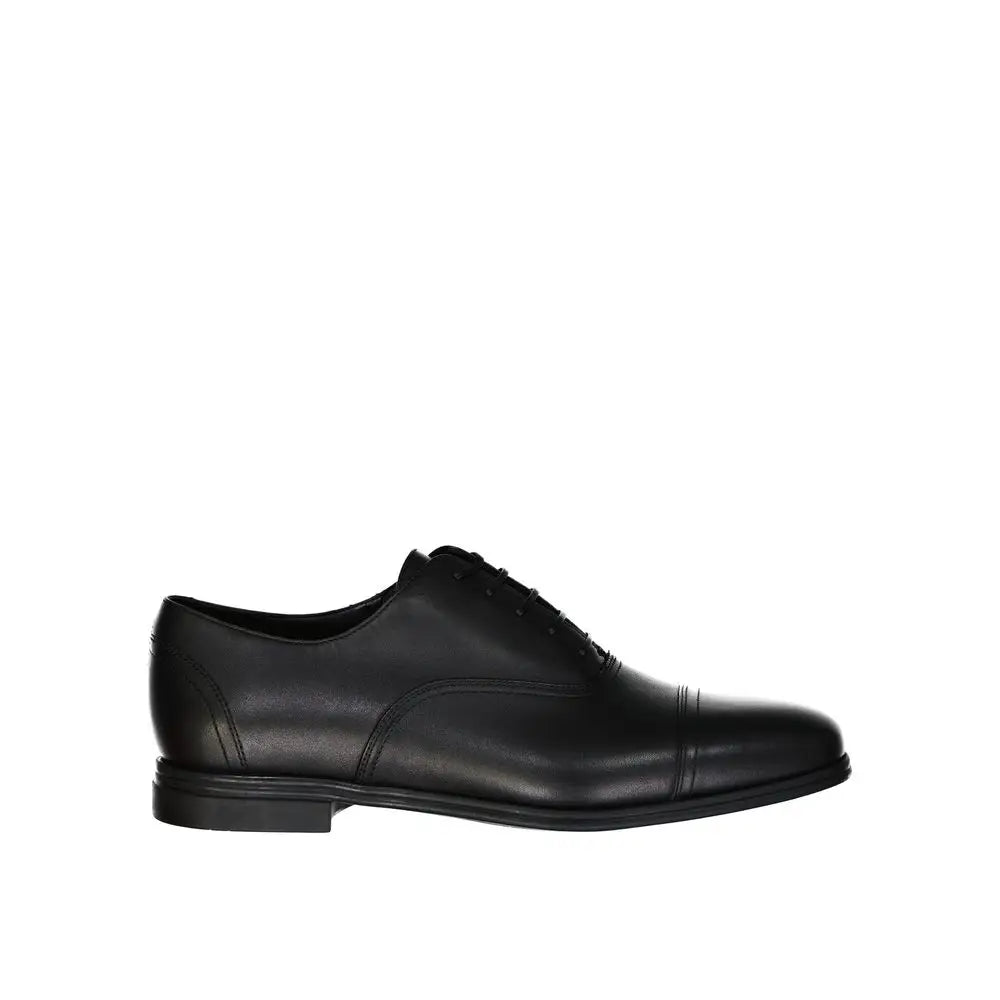 Salvatore Ferragamo sorte læder oxfords med cap-toe og poleret finish